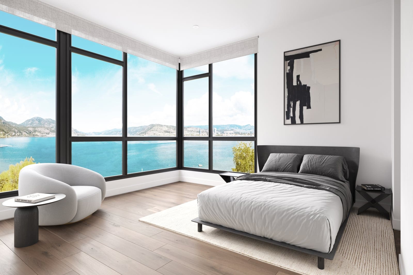 Waterfront Tower bedroom with floor-to-ceiling corner windows above Okanagan Lake